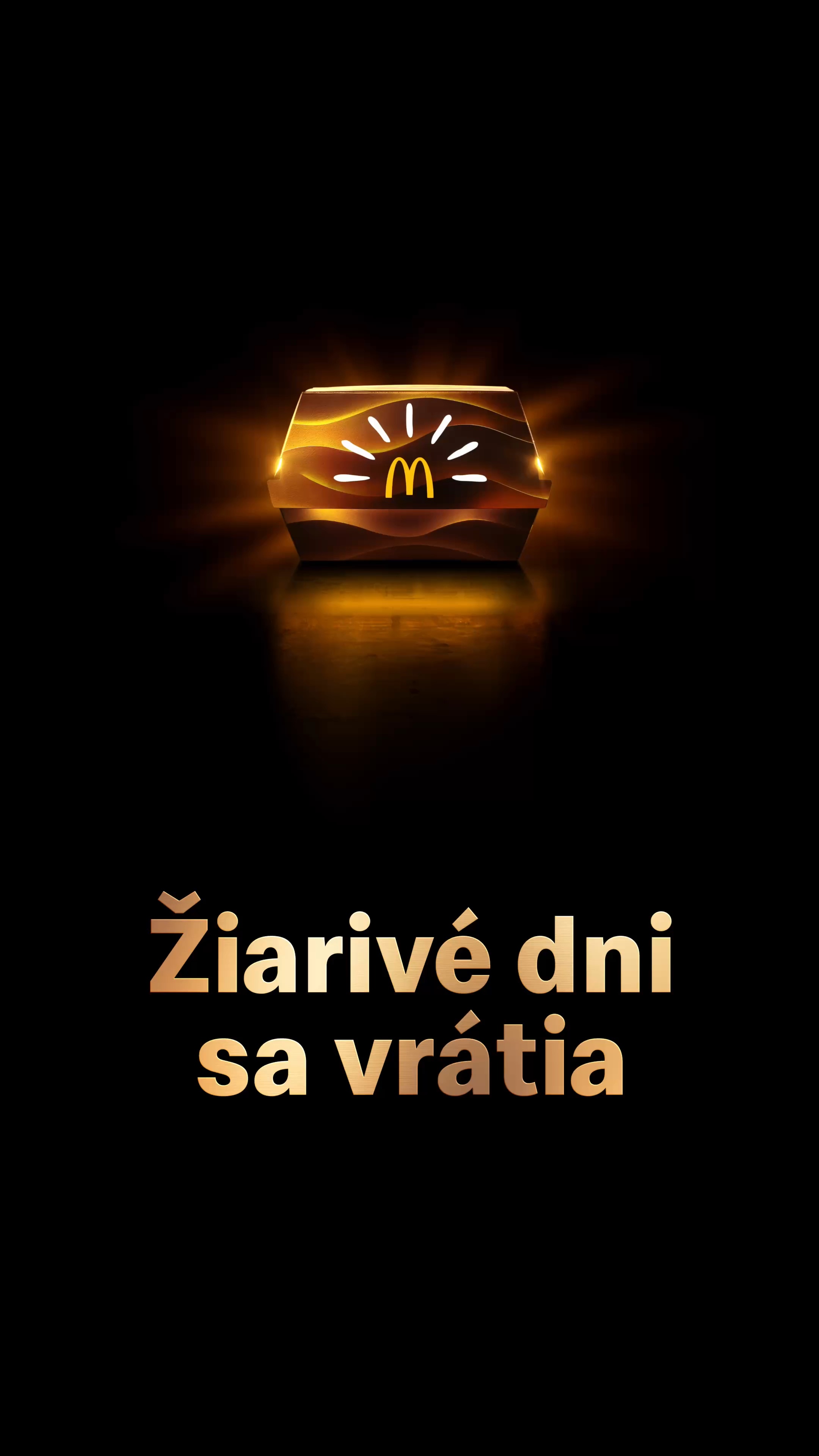 Žiariaca škatuľka so zlatými oblúkmi a lúčmi